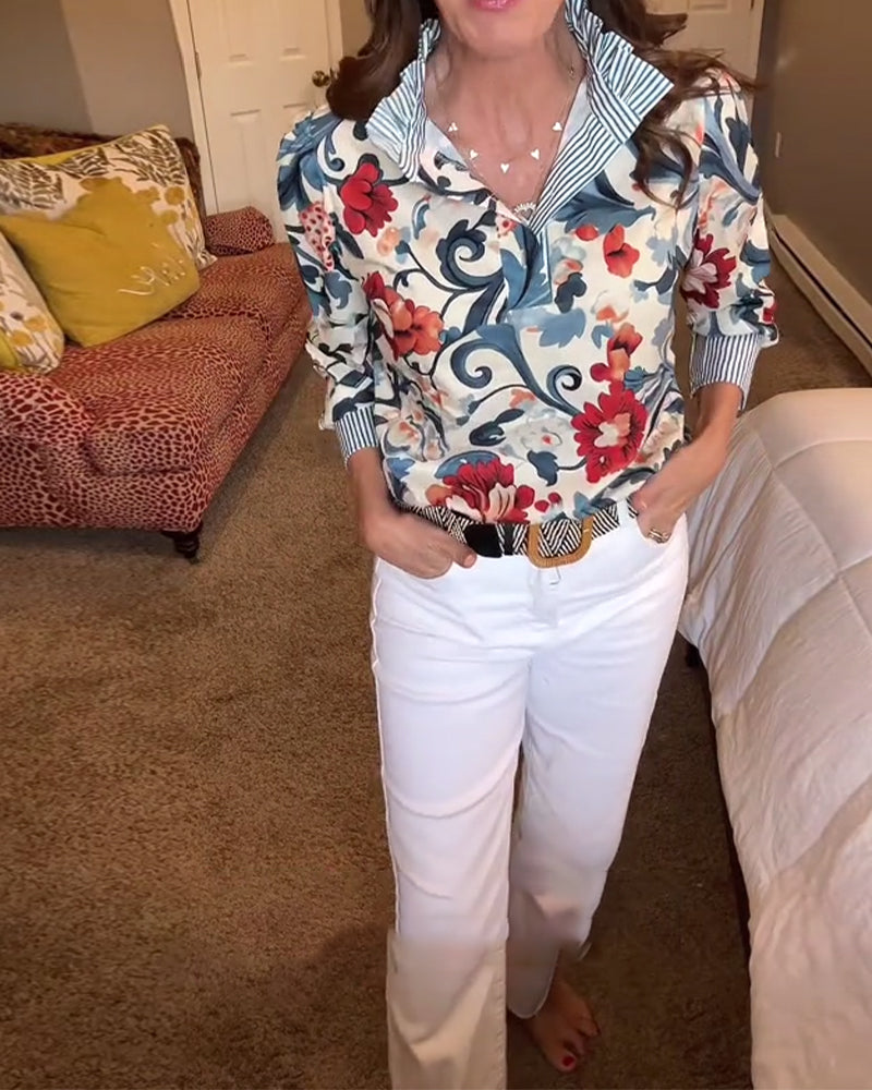 Blusa a righe floreali con maniche a sbuffo