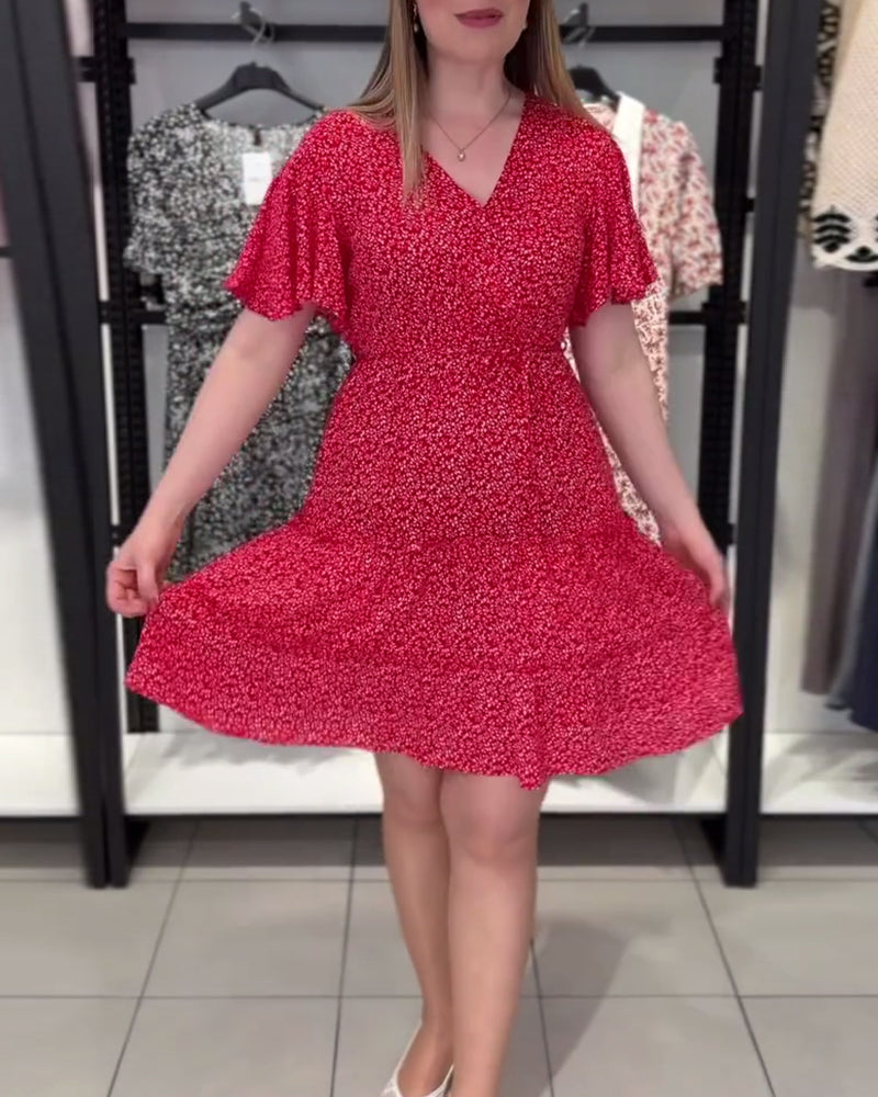 Abito aderente con stampa floreale e scollo a V