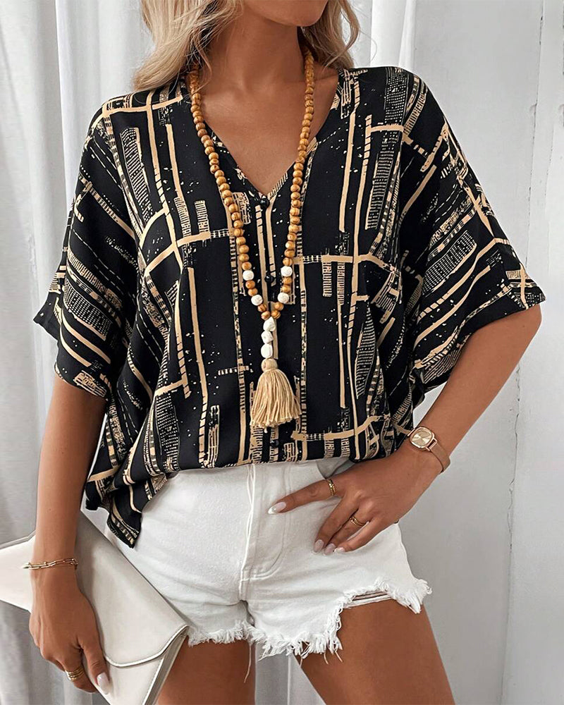 Camicetta stampata con scollo a V retrò e maniche a pipistrello