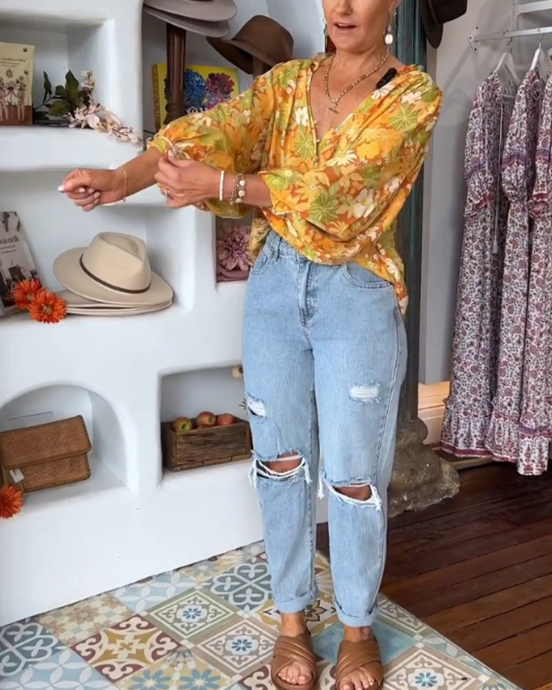 Blusa con stampa floreale con scollo a V