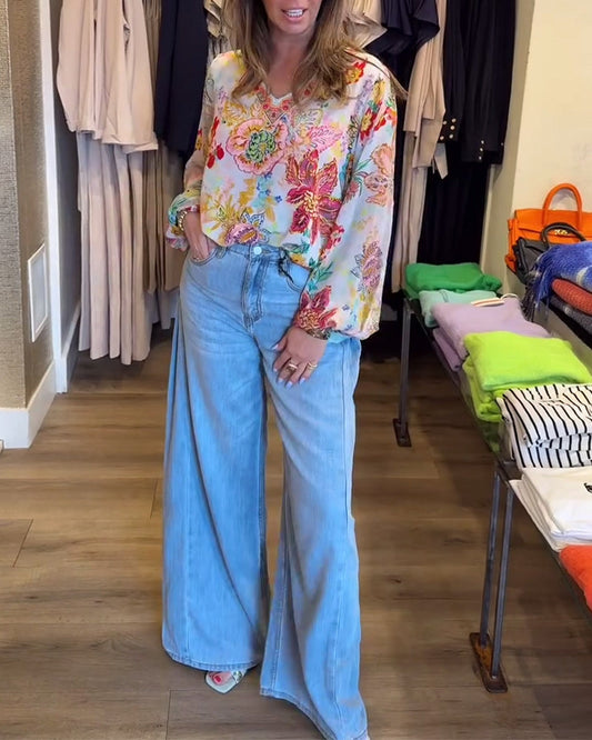 Blusa con stampa floreale colorata e scollo a V