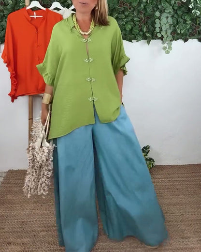 Camicia con maniche a pipistrello e bottoni sul risvolto