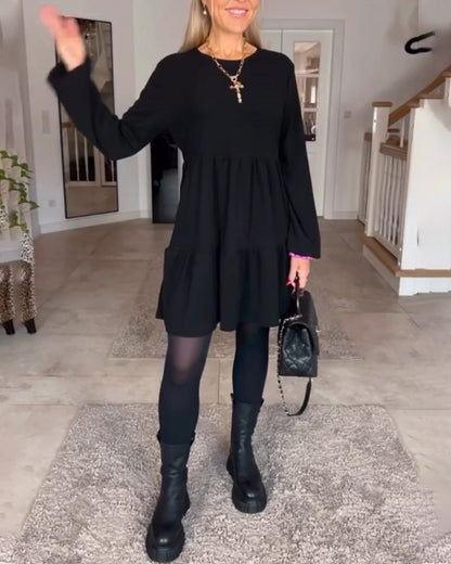 Vestido sencillo de manga larga de color liso.