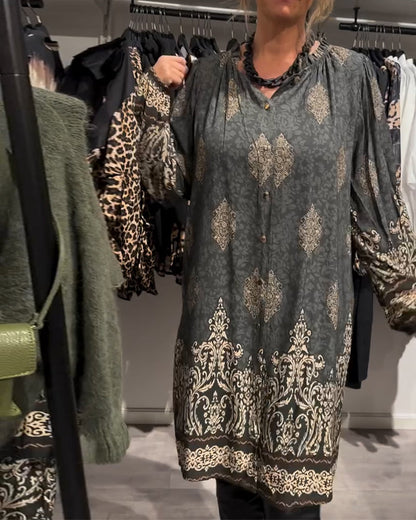 Abito con stampa vintage e bottoni a bavero