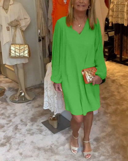 Ensfarget kjole med lanterne med V-hals