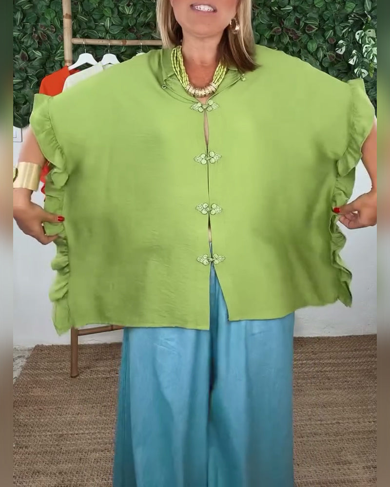 Camicia con maniche a pipistrello e bottoni sul risvolto