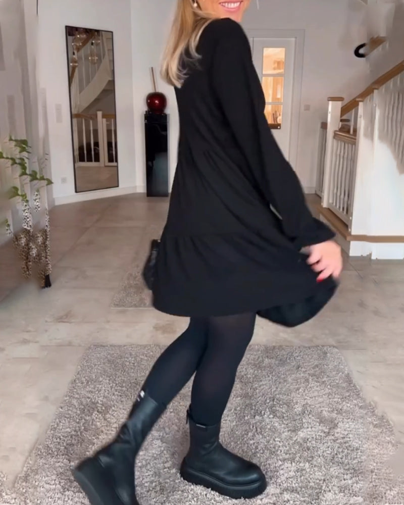 Vestido sencillo de manga larga de color liso.