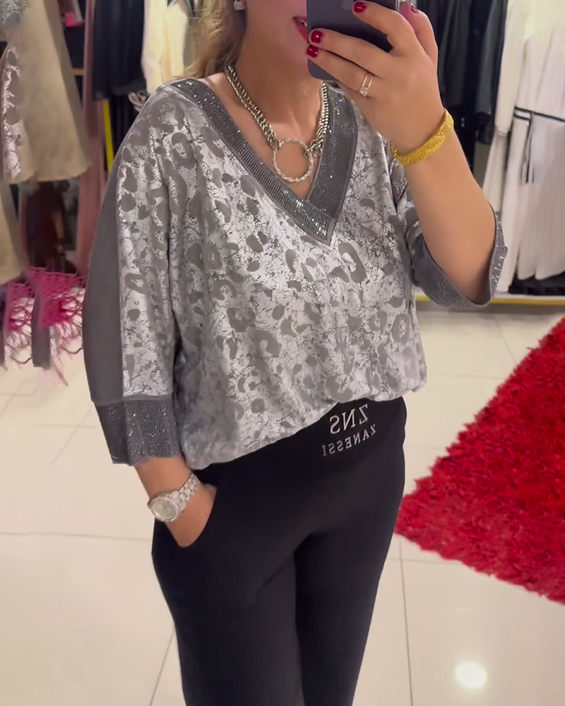 Blusa casual stampata con scollo a V