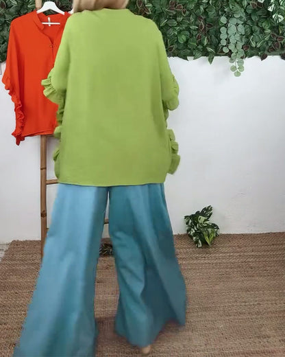 Camicia con maniche a pipistrello e bottoni sul risvolto