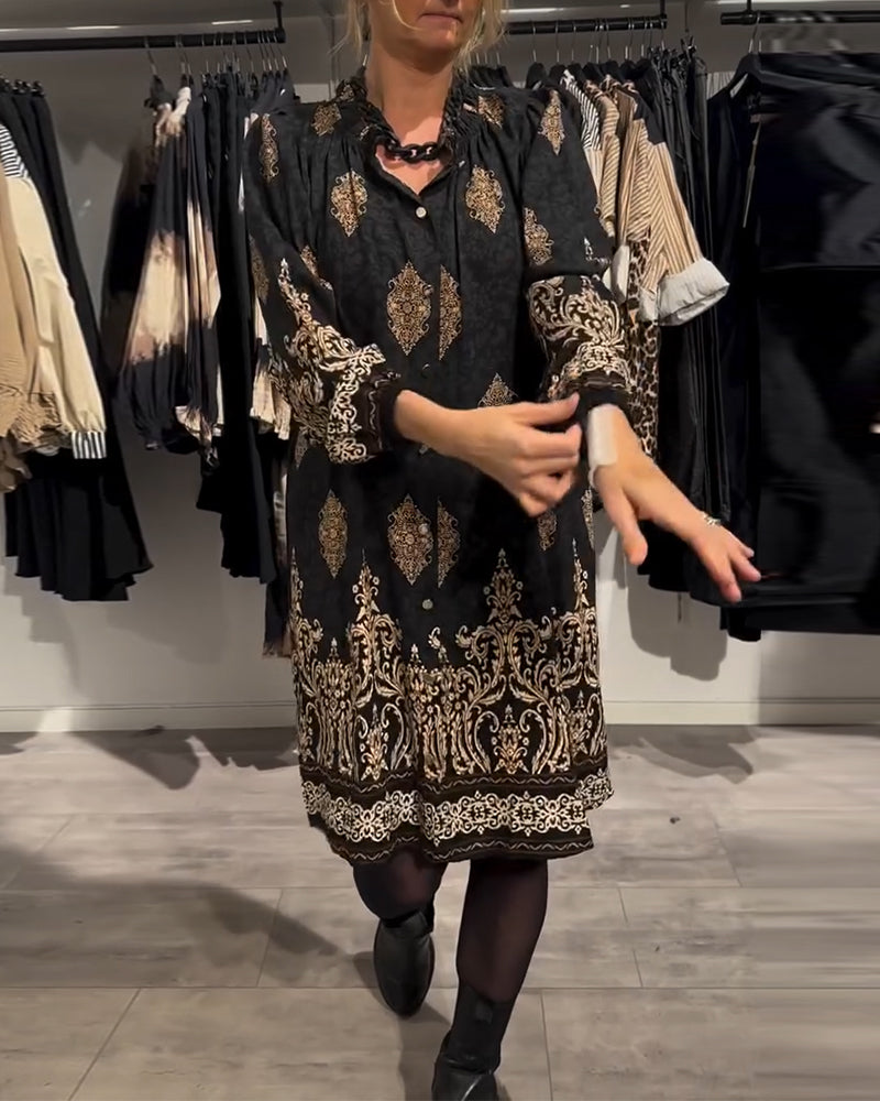 Abito con stampa vintage e bottoni a bavero