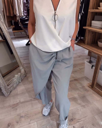 Canotta tinta unita con mezza zip senza maniche