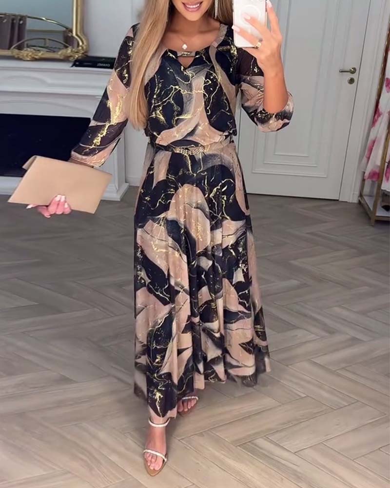 Elegante abito stampato con maniche a tre quarti