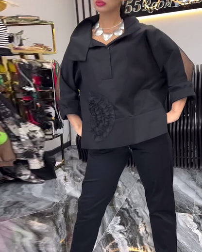 Bluse mit Blumenmuster und Spitzenbesatz am Revers