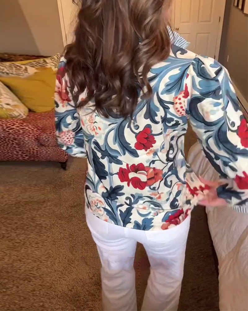 Blusa a righe floreali con maniche a sbuffo