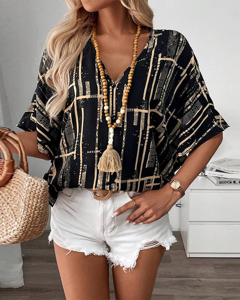 Camicetta stampata con scollo a V retrò e maniche a pipistrello