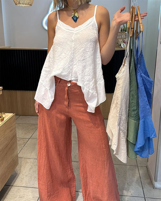 Top canotta irregolare senza maniche in tinta unita