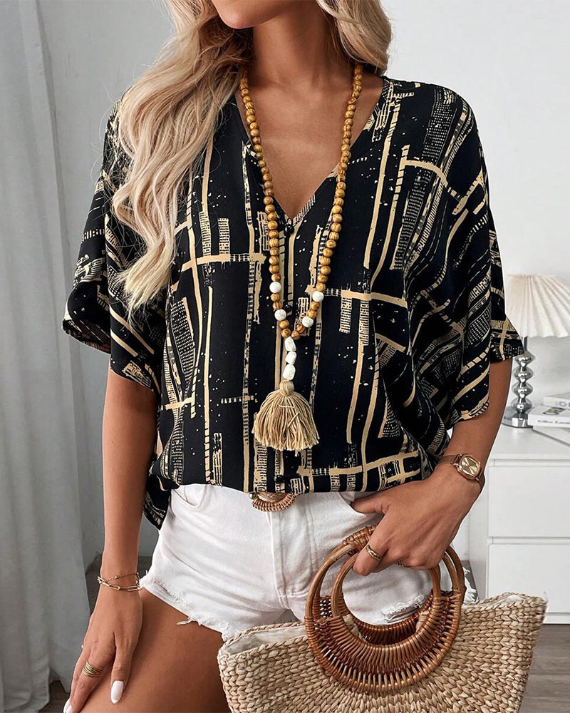 Camicetta stampata con scollo a V retrò e maniche a pipistrello