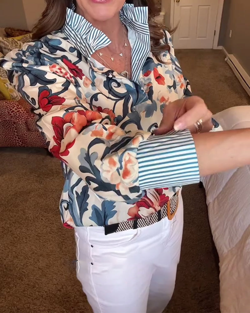 Blusa a righe floreali con maniche a sbuffo