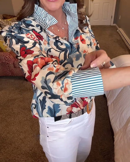 Blusa a righe floreali con maniche a sbuffo