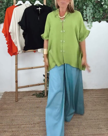 Camicia con maniche a pipistrello e bottoni sul risvolto