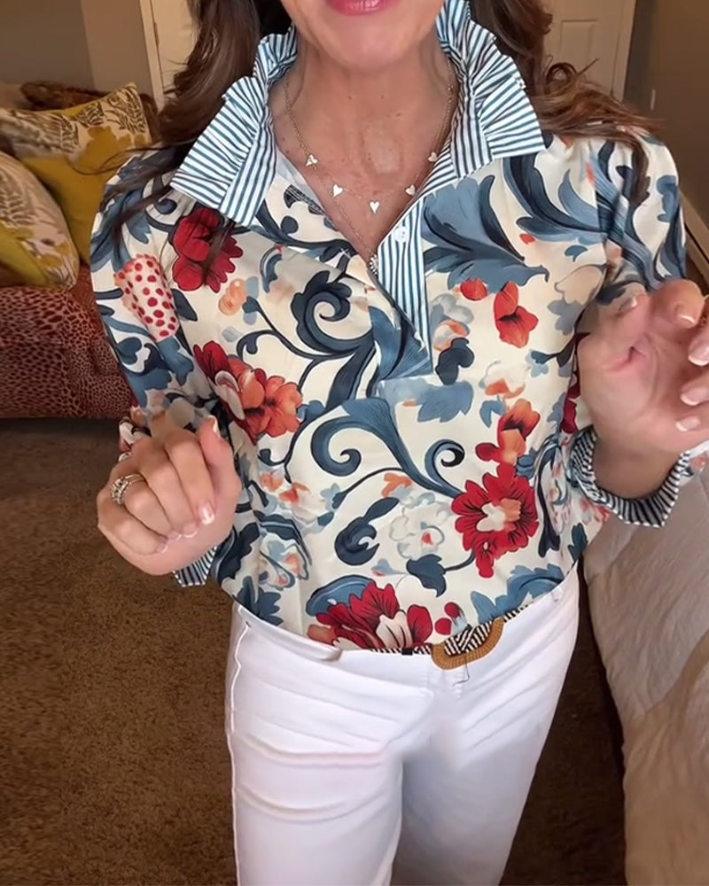 Blusa a righe floreali con maniche a sbuffo