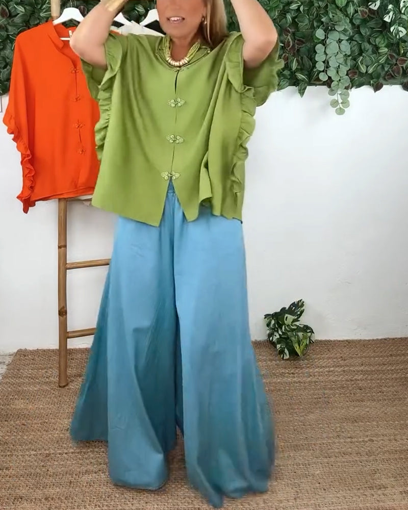 Camicia con maniche a pipistrello e bottoni sul risvolto